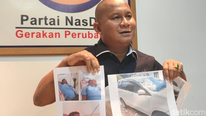 anggota DPRD Sumut melempar batu saat kericuhan di Medan