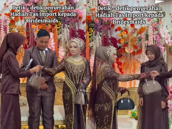 Pengantin membagikan tas impor kepada para bridesmaid di pelaminan