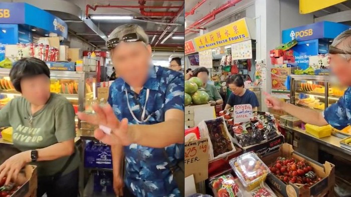 penjual buah di Singapura melayani turis di pasar